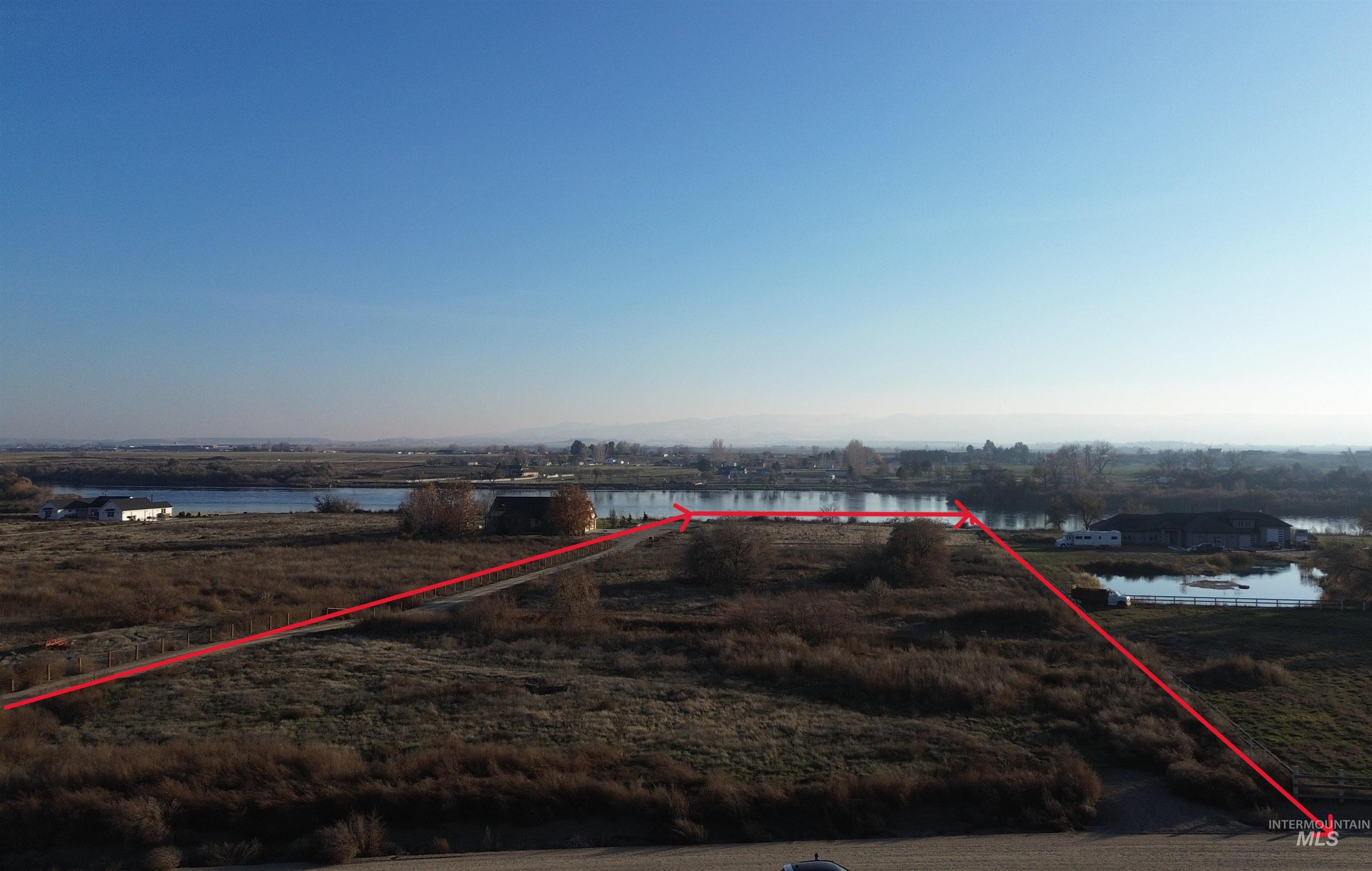 View of property location with property boundaries highlighted and a nearby body of water