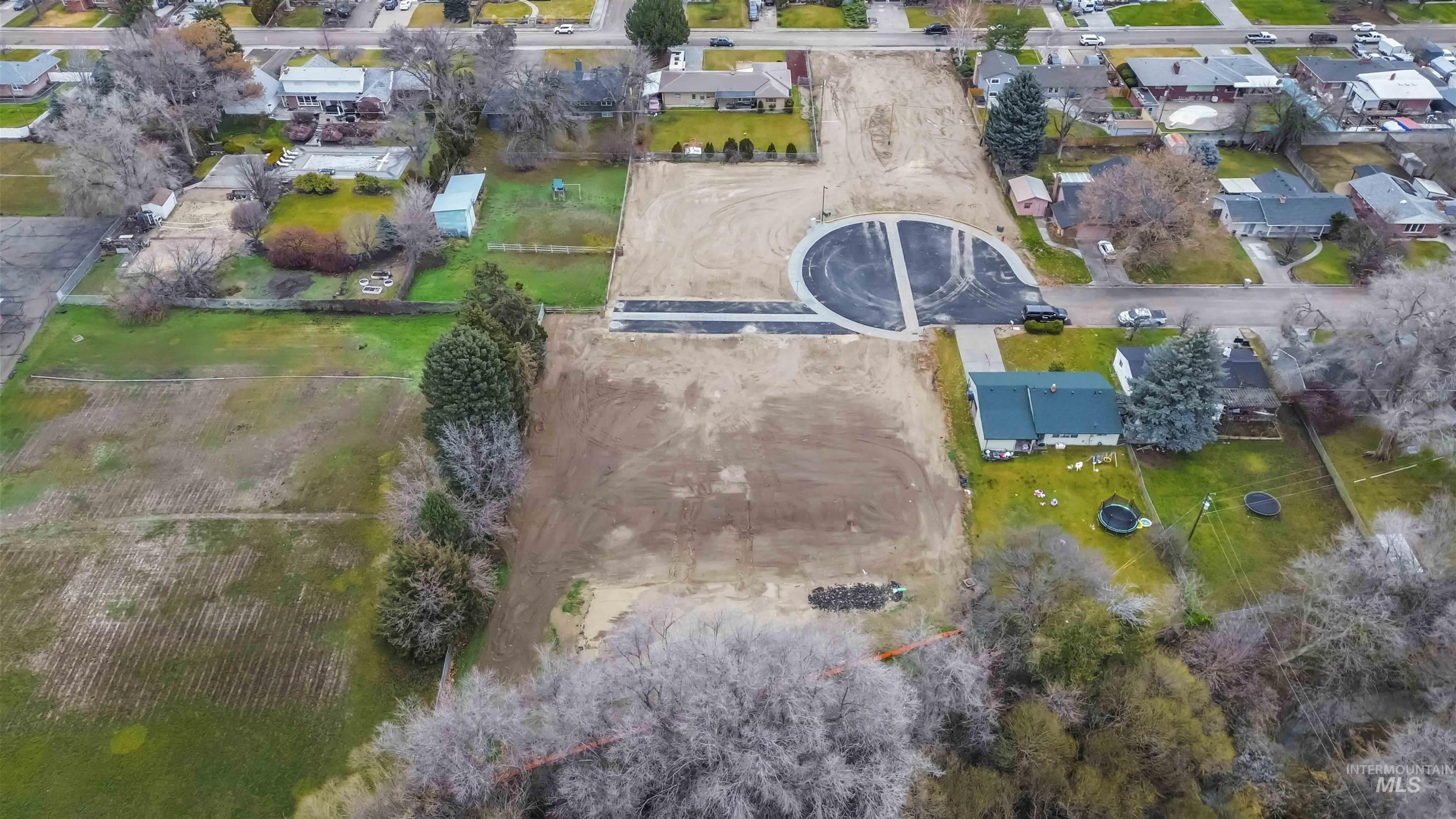Aerial view of property's location featuring nearby suburban area