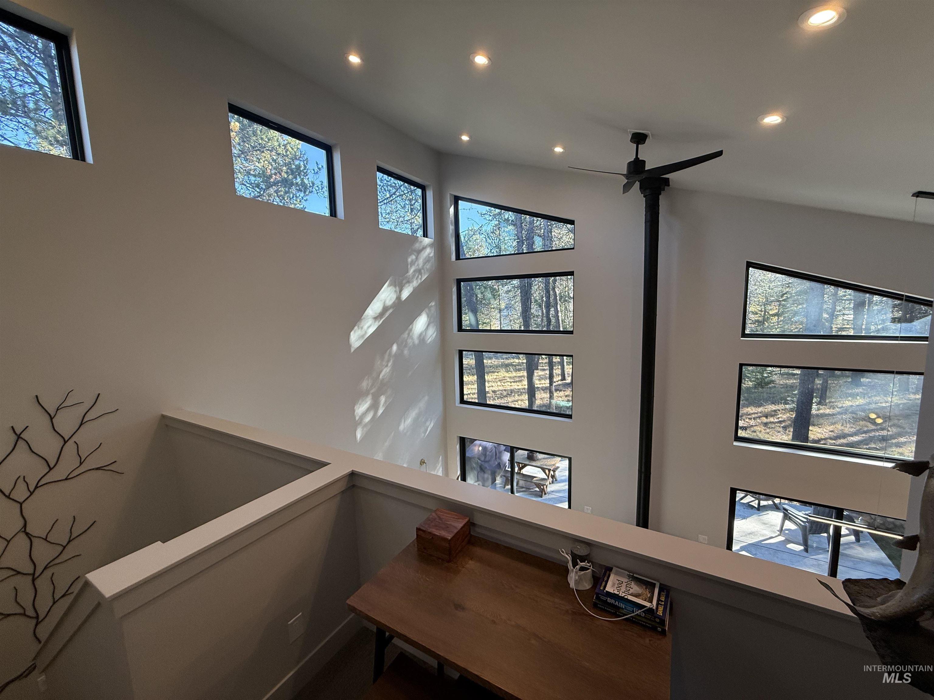 Detailed view of recessed lighting and a ceiling fan