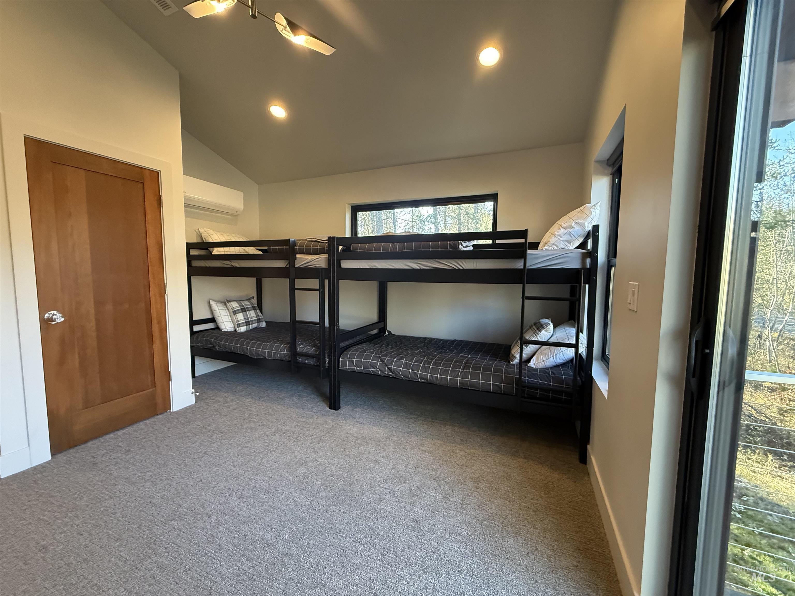 Bedroom featuring light carpet, vaulted ceiling, recessed lighting, and a ceiling fan