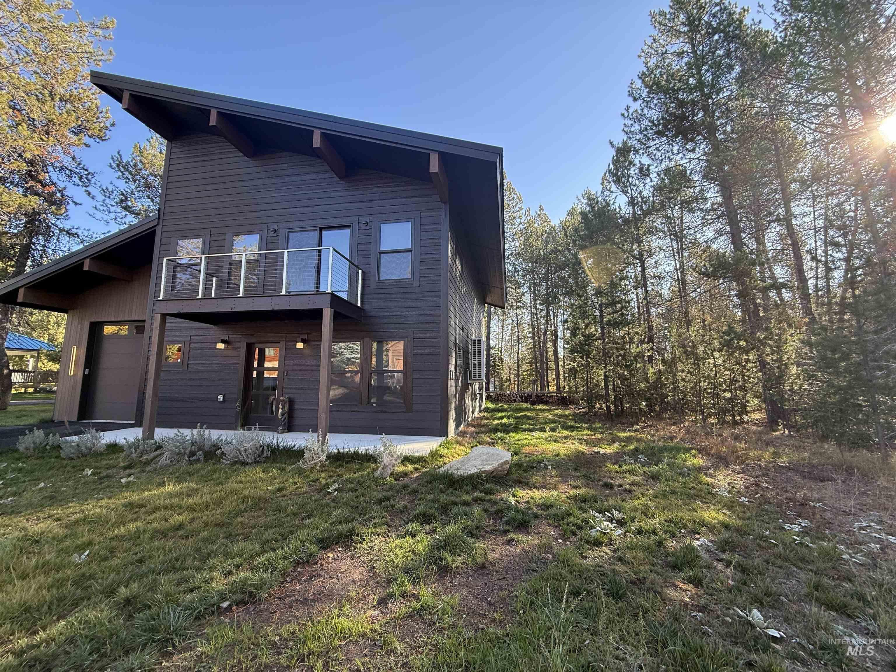 Rear view of property featuring a lawn