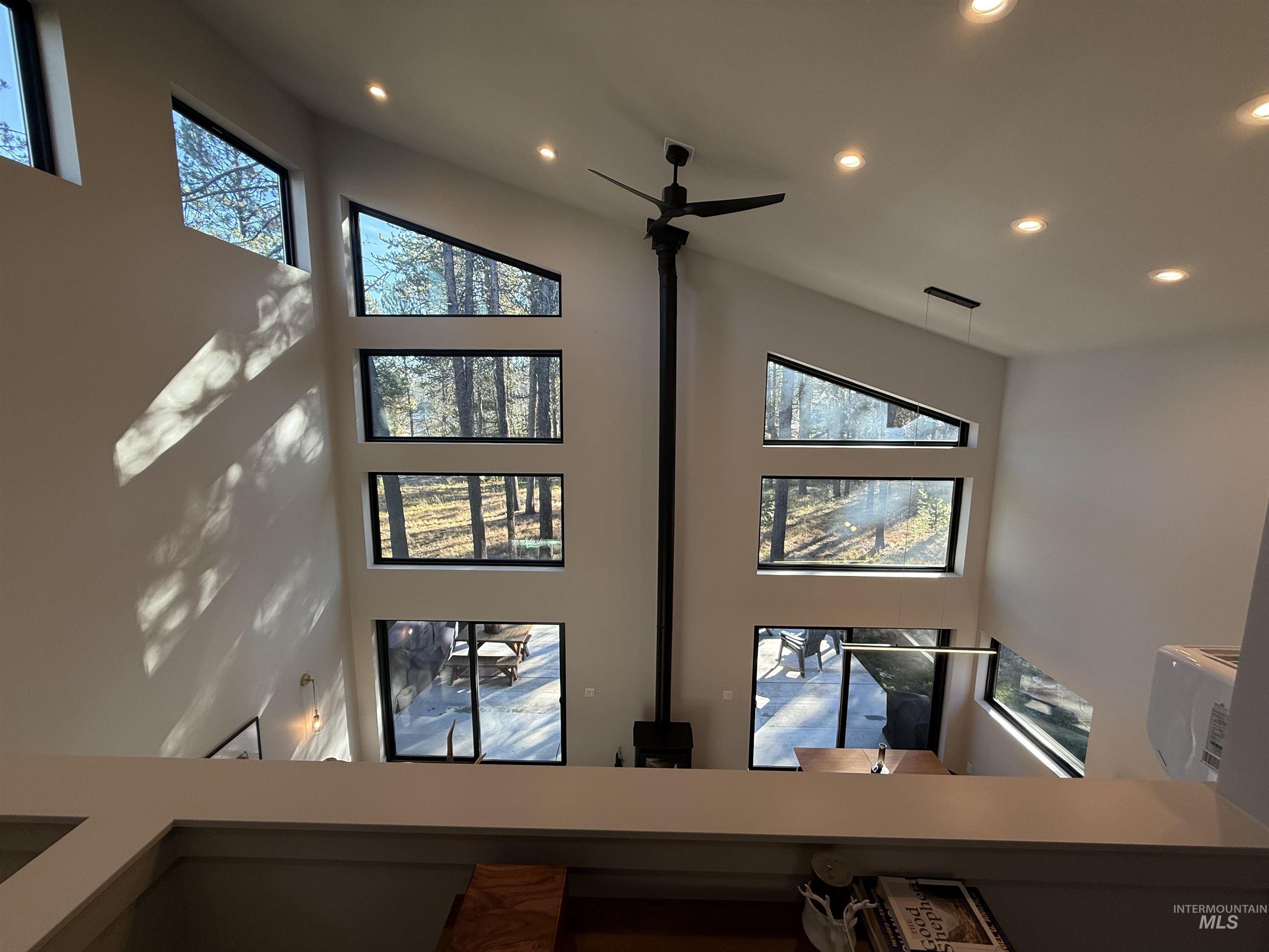 Detailed view of recessed lighting and ceiling fan