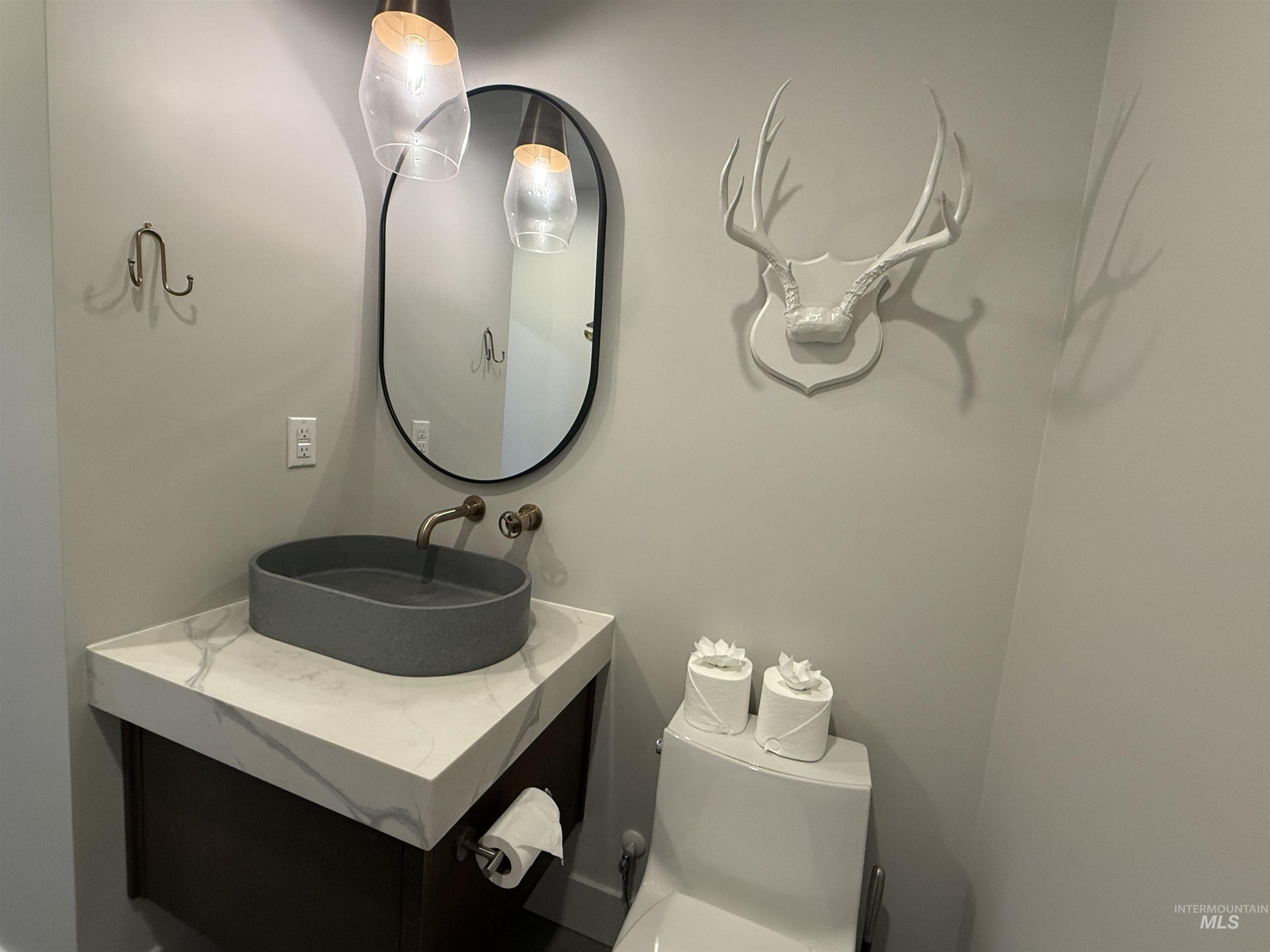 Bathroom featuring toilet and vanity