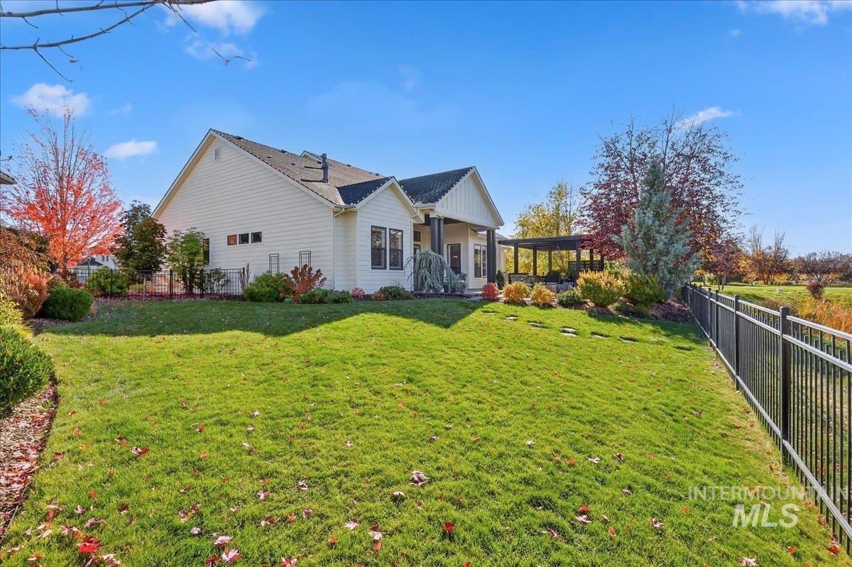 Back of house featuring a fenced backyard