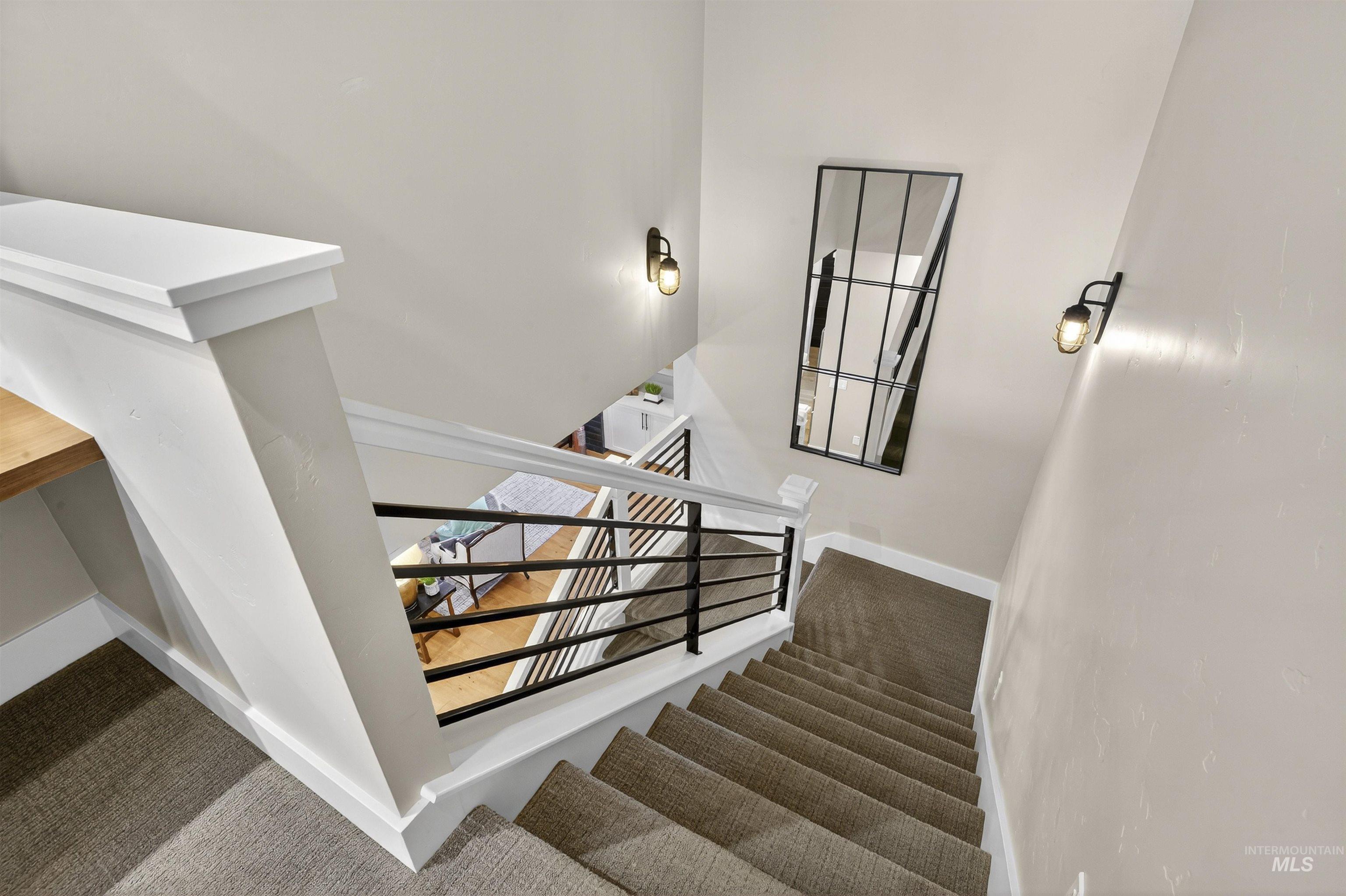 Stairs with carpet and baseboards
