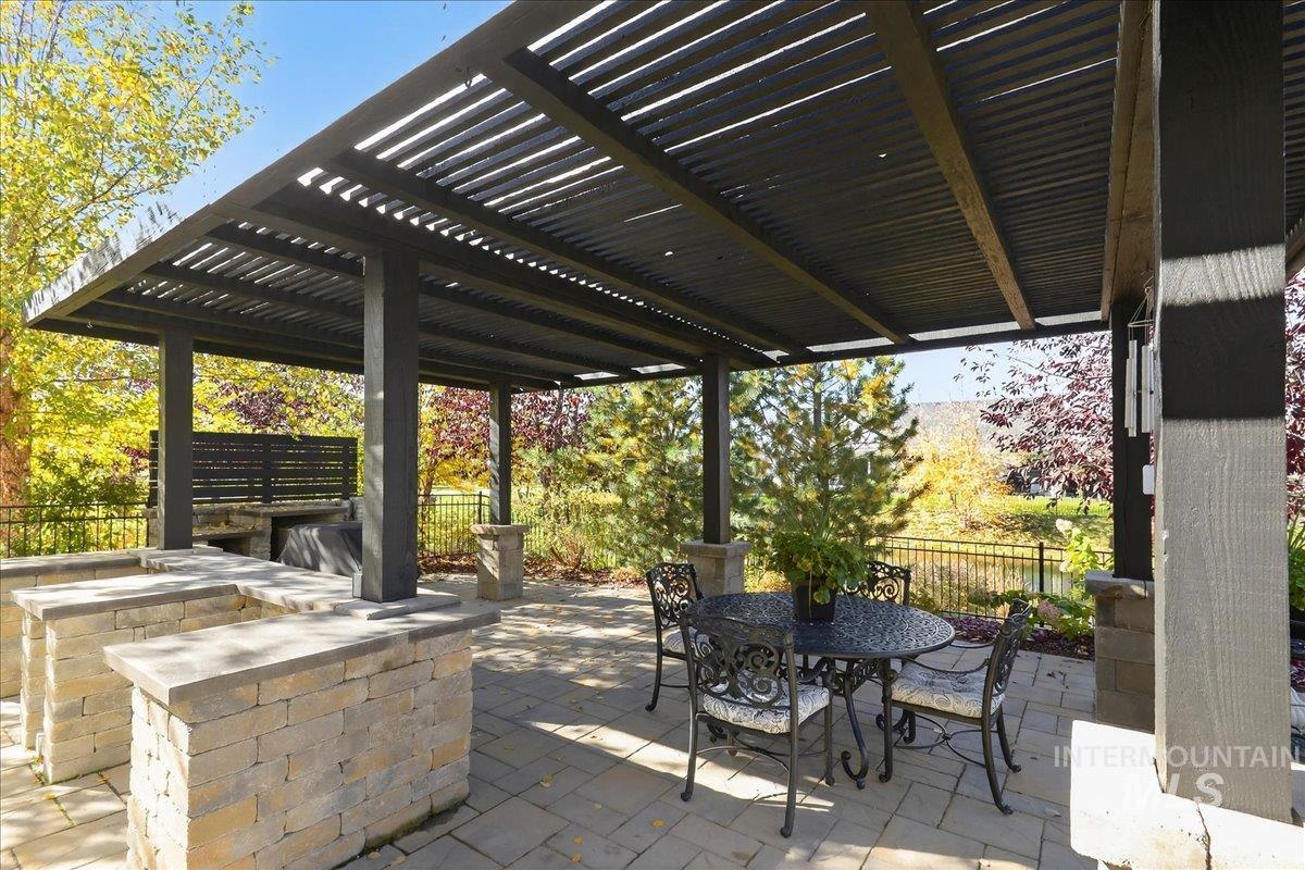 View of patio / terrace featuring outdoor dining area and a pergola