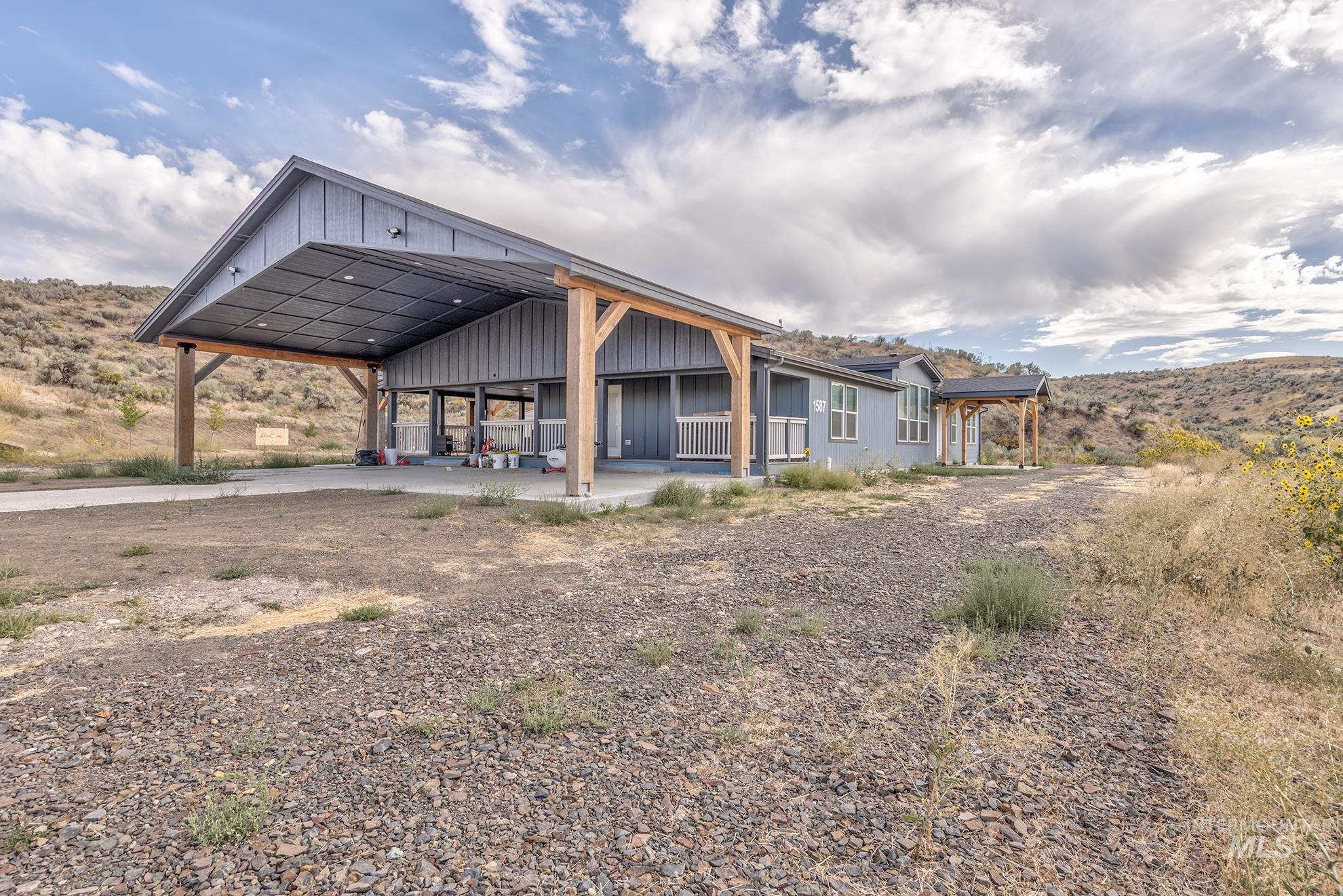 View of side of property featuring board and batten siding and a mountain view