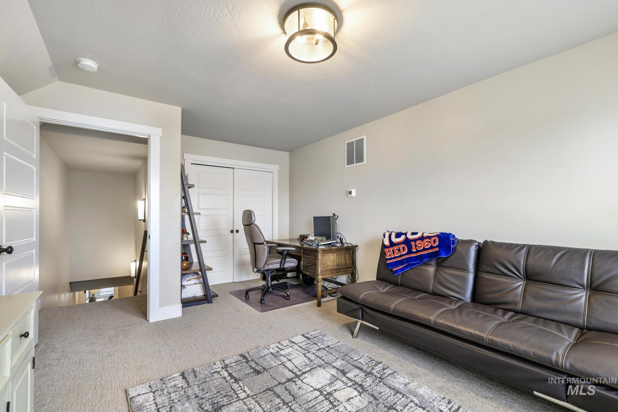 Office area featuring light colored carpet