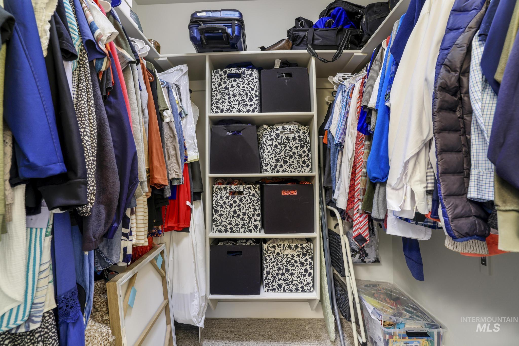 Walk in closet featuring carpet flooring