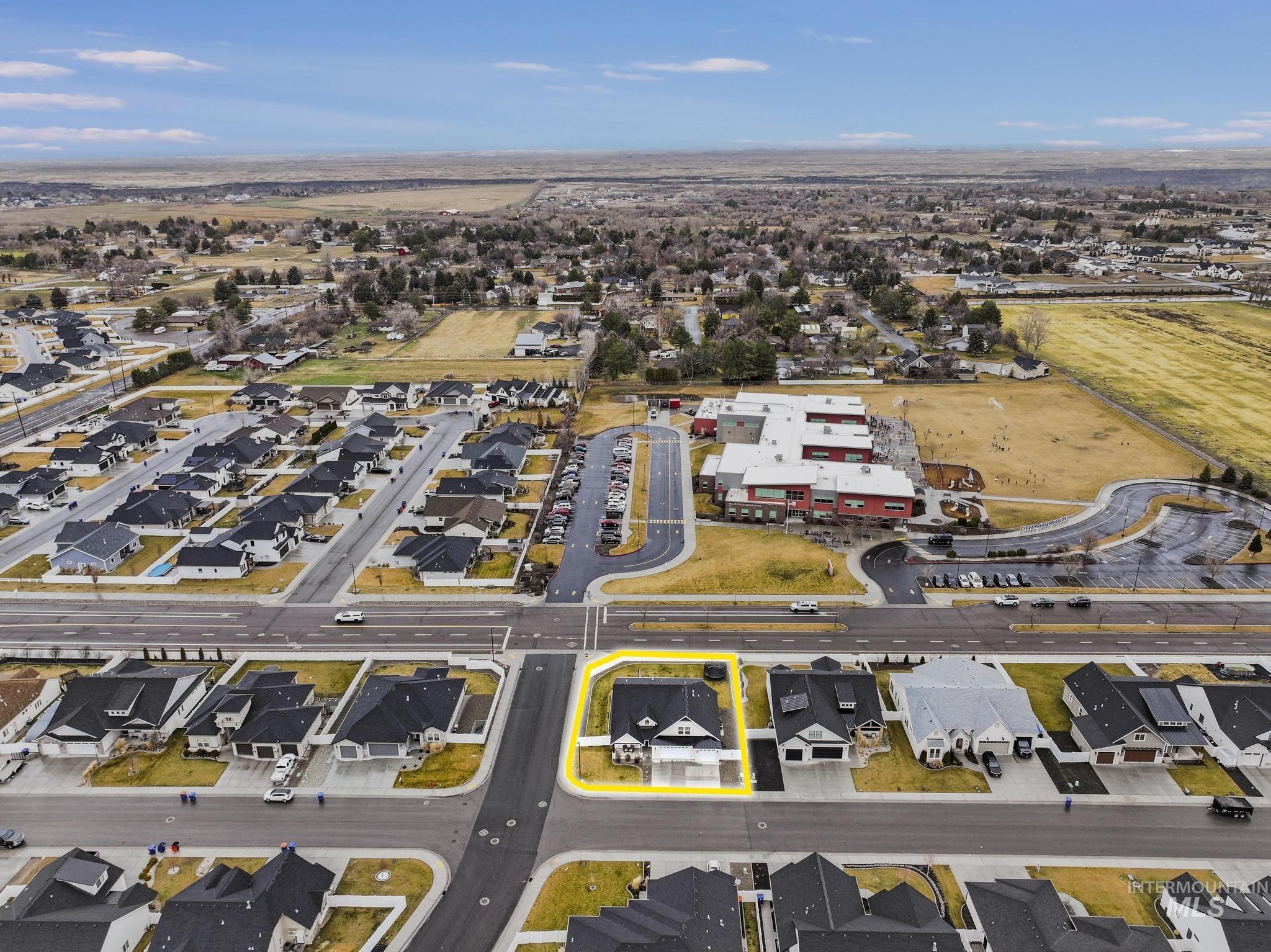 Aerial overview of property's location with nearby suburban area