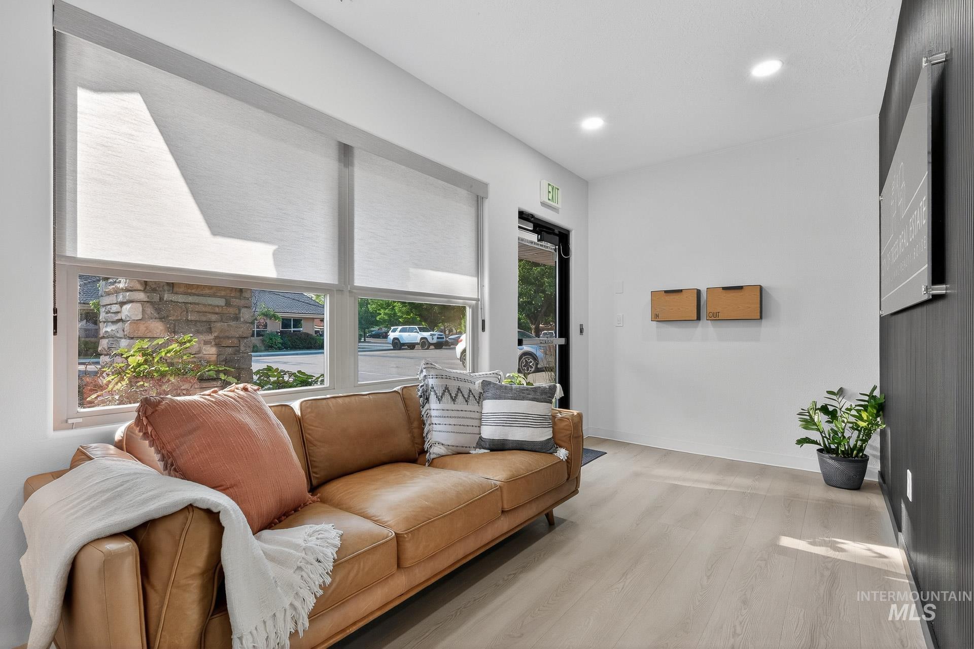 Living room featuring wood finished floors and recessed lighting