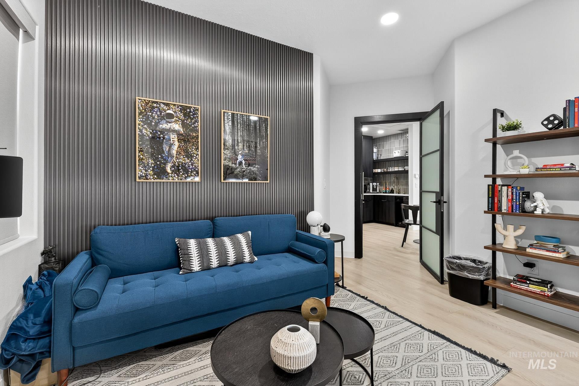 Living area featuring wood finished floors and recessed lighting