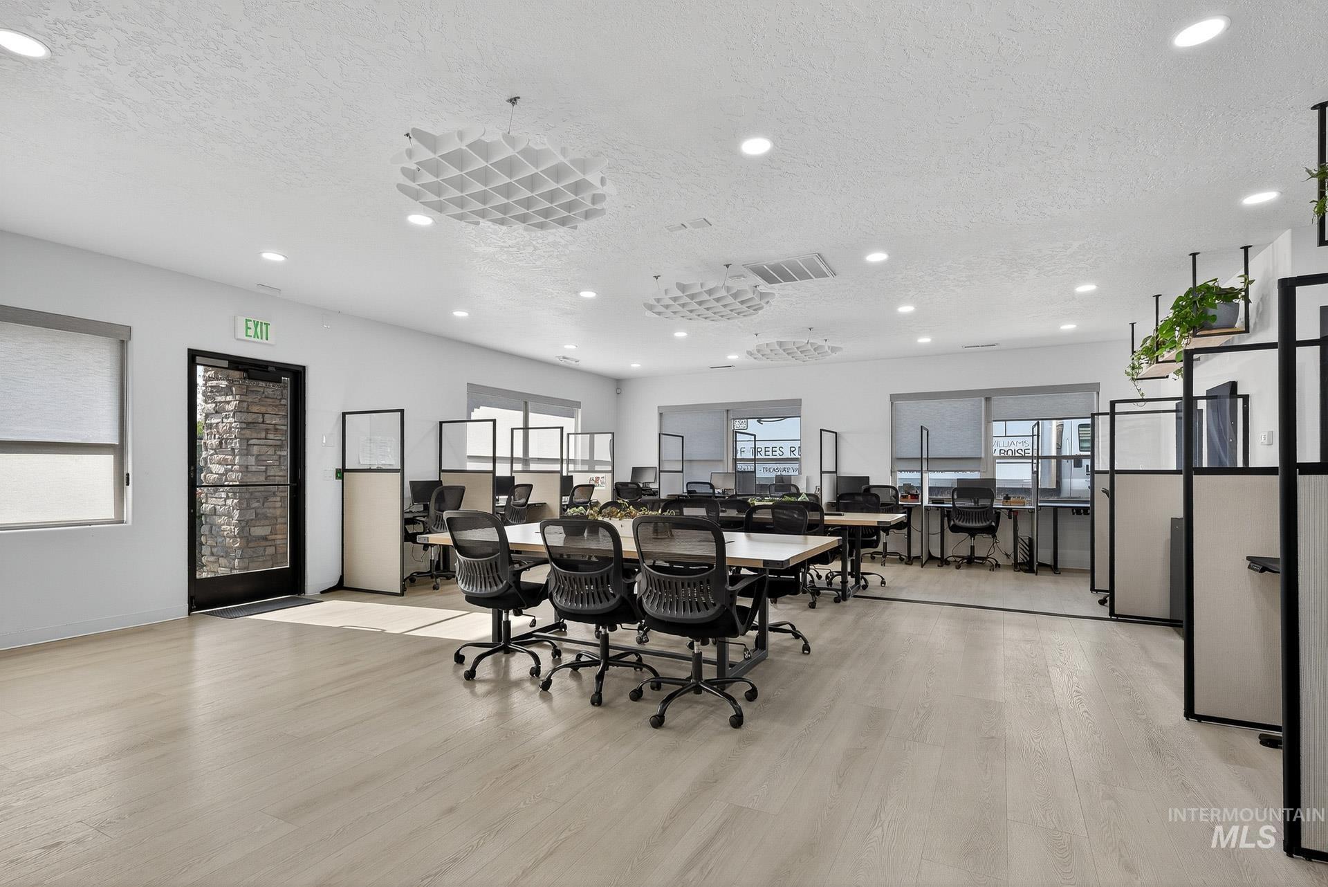Dining area featuring an office area, a textured ceiling, recessed lighting, and light wood-type flooring