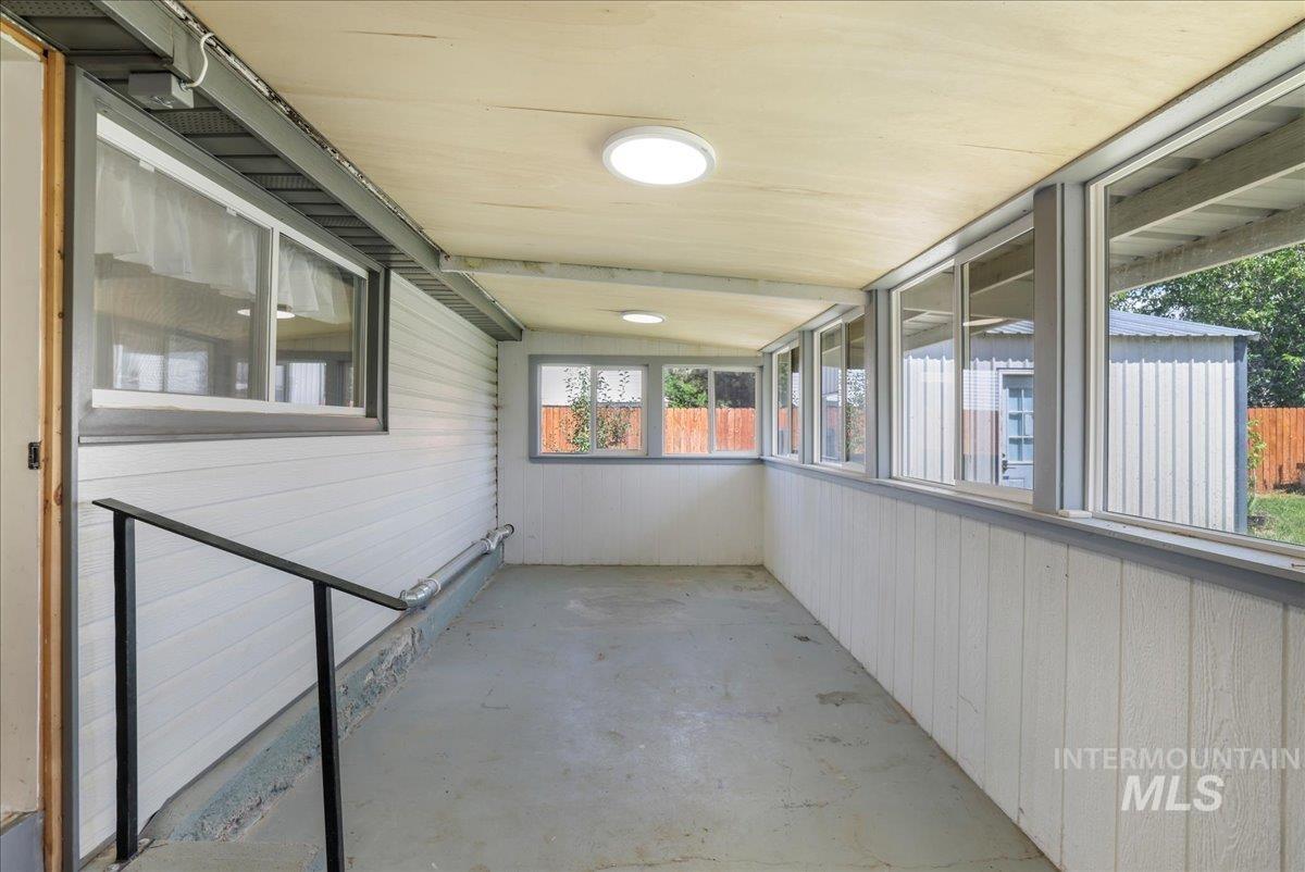 Unfurnished sunroom with healthy amount of natural light