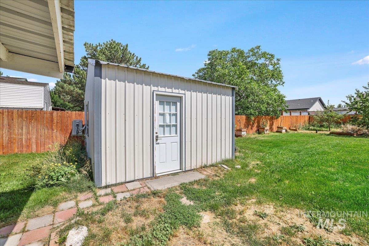 View of shed featuring a fenced backyard