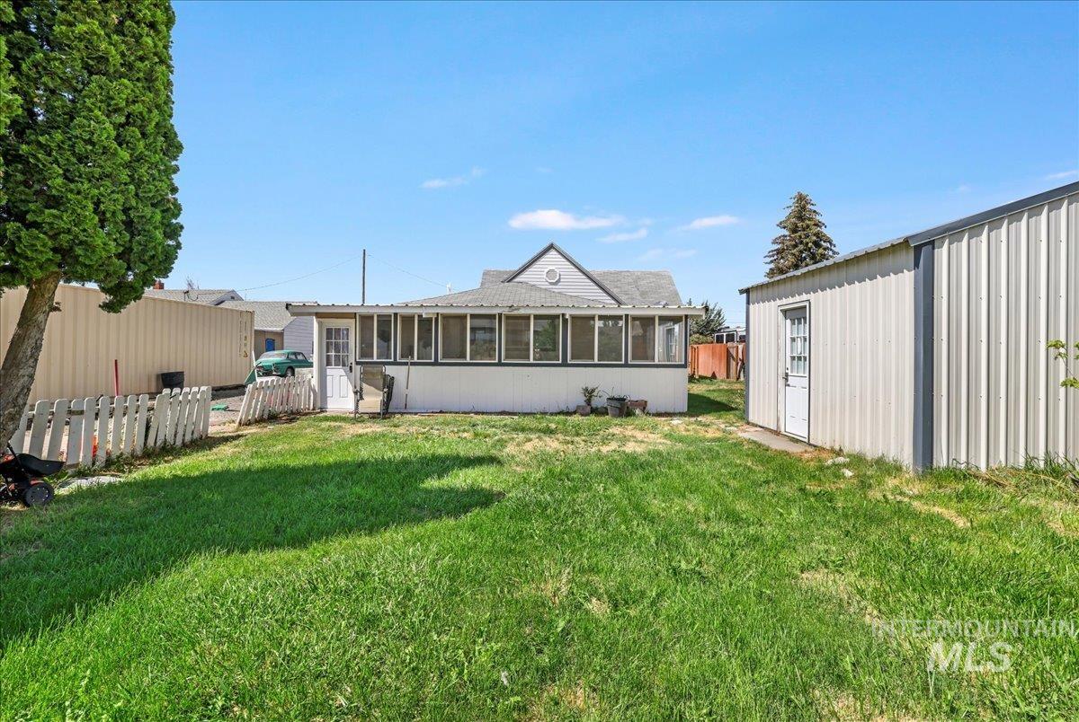 View of yard with a sunroom