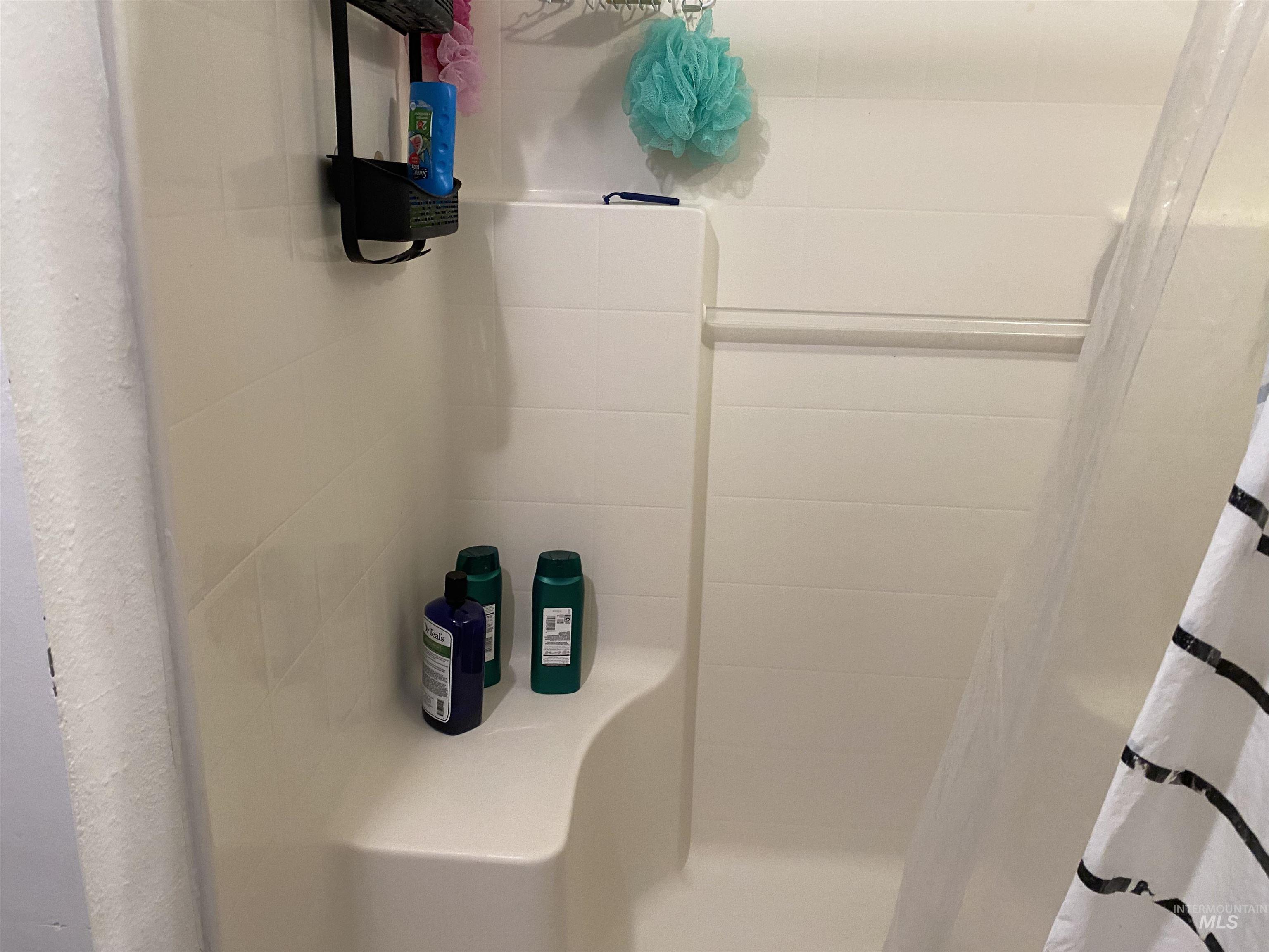 Full bathroom with a stall shower