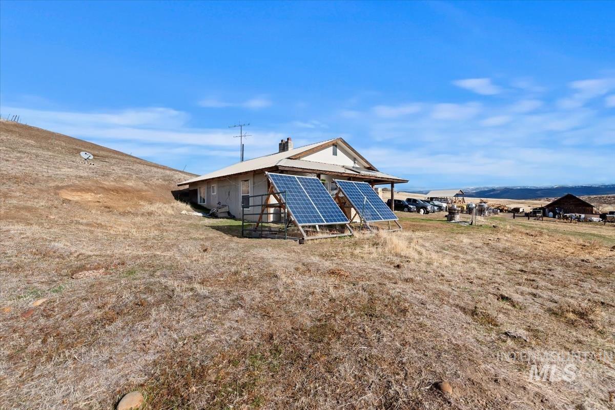 Rear view of house with solar panels