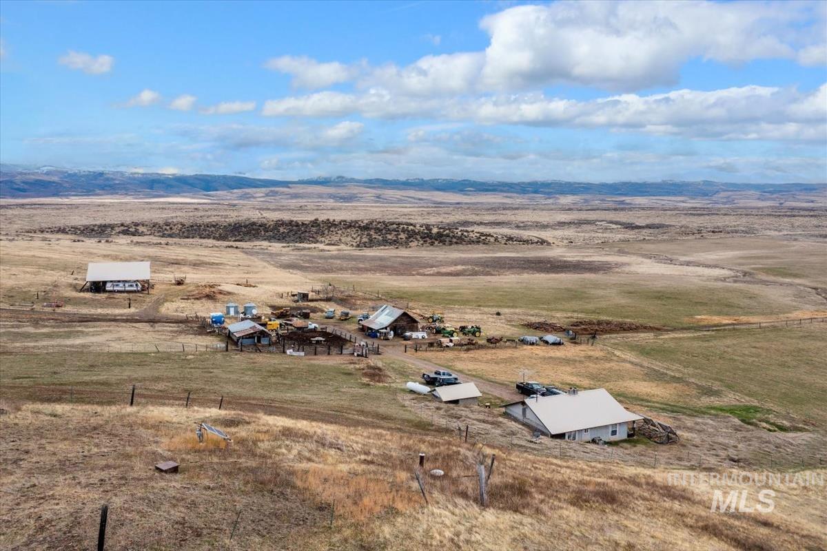 Aerial view of sparsely populated area featuring a desert landscape and a mountain backdrop