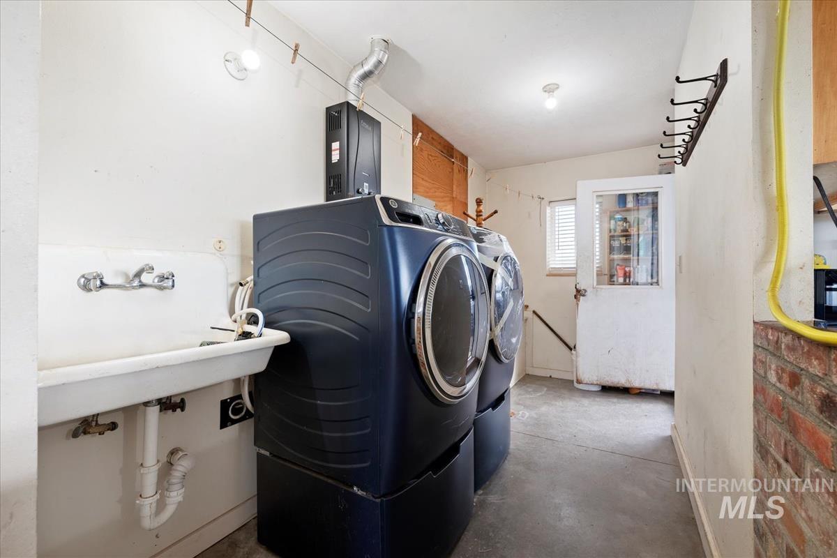 Laundry room featuring washing machine and dryer and cabinet space