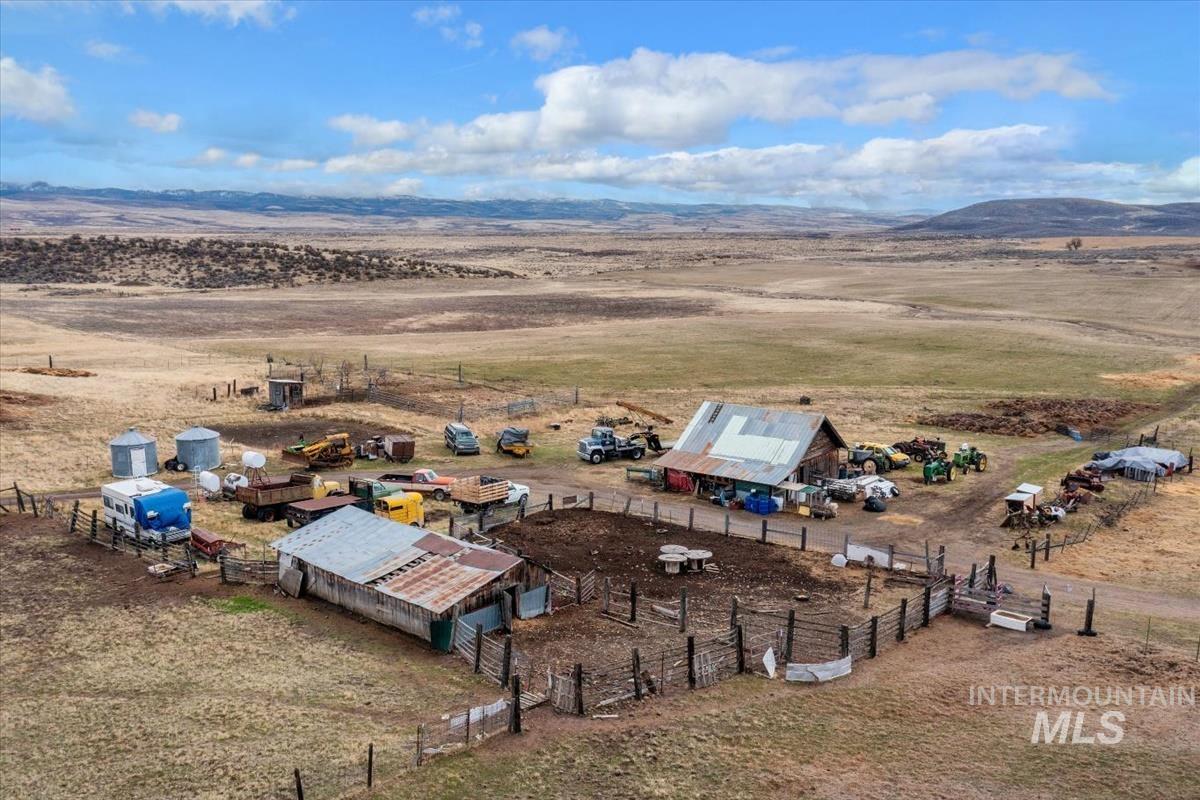 View of rural area featuring mountains and a desert landscape