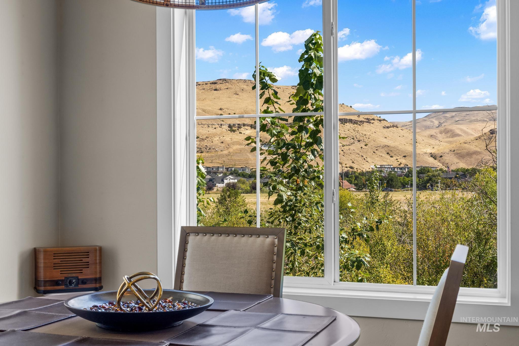 Dining space featuring a mountain view and plenty of natural light