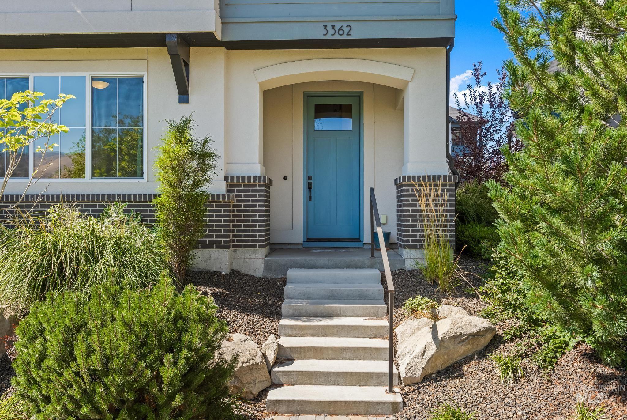 Entrance to property featuring brick siding