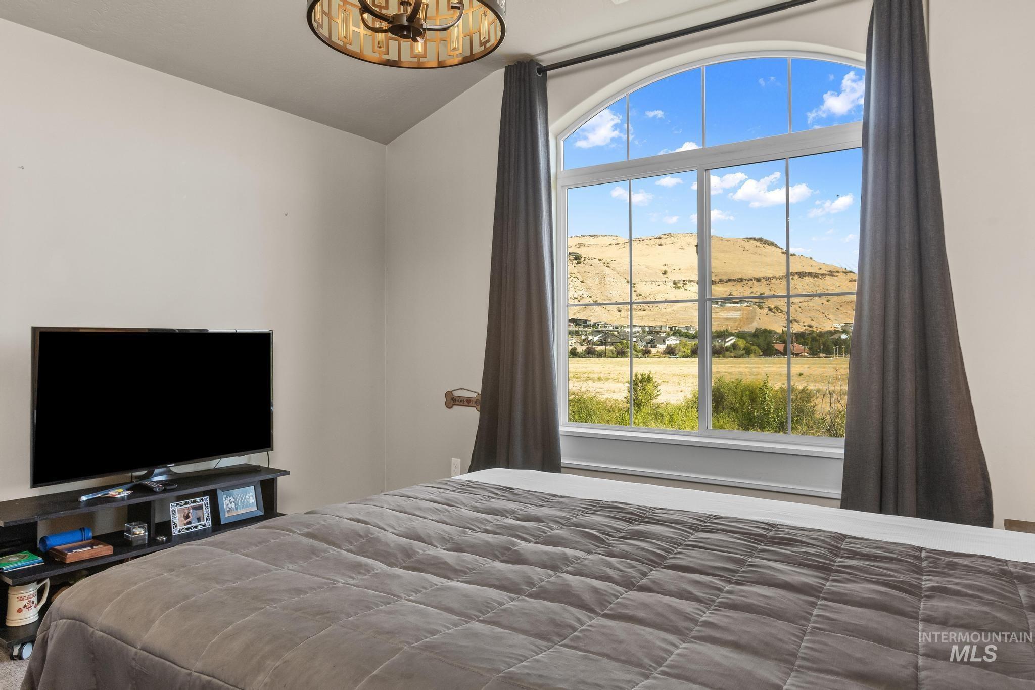 Bedroom featuring a mountain view