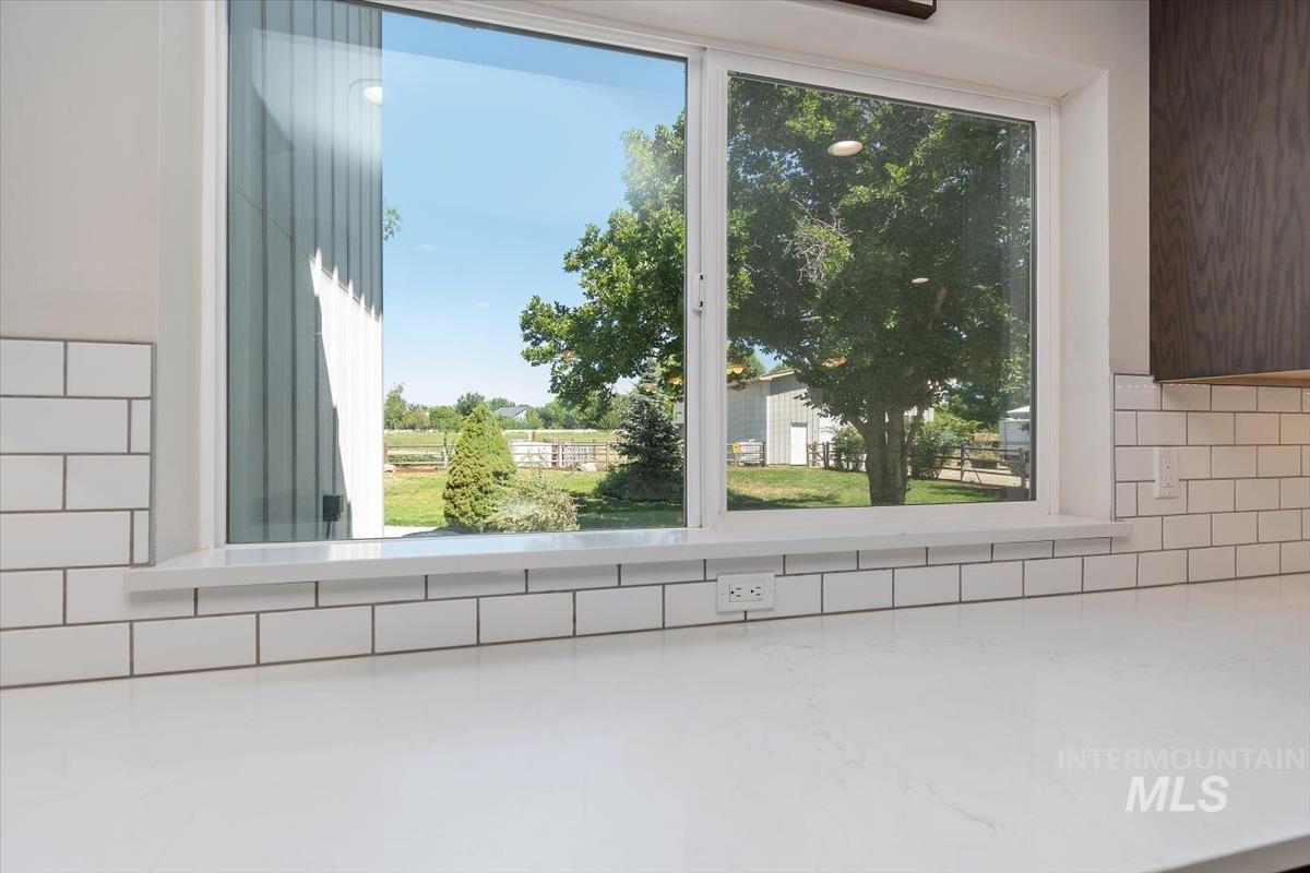 White subway tile backsplash with dark grout