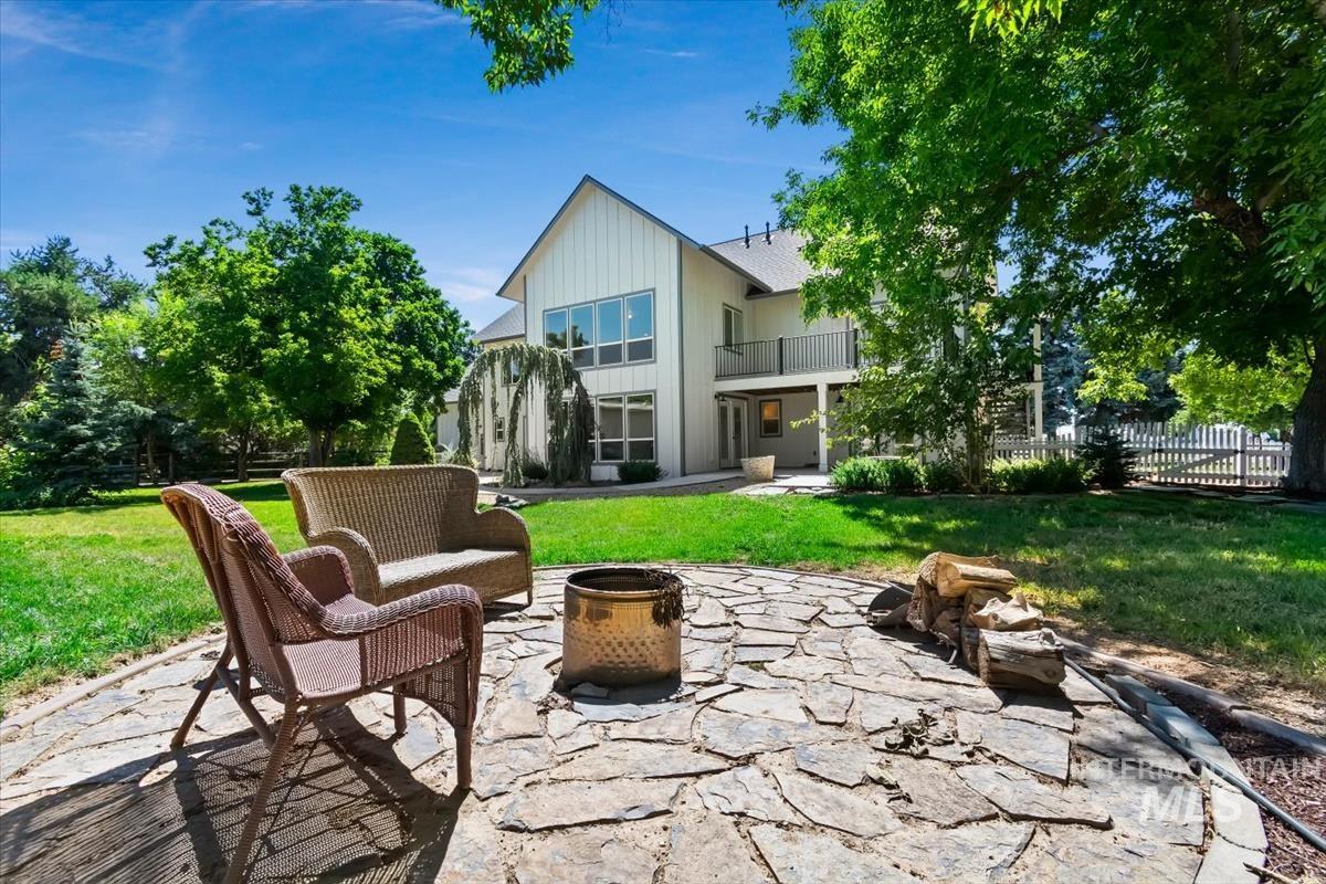 Stone patio featuring a central fire pit