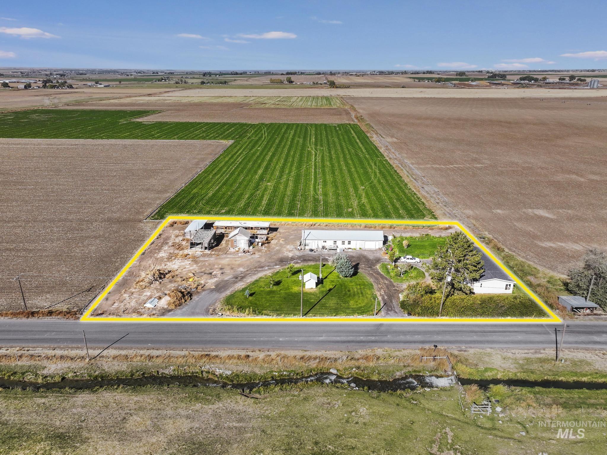 View of rural area with property parcel outlined and extensive farmland