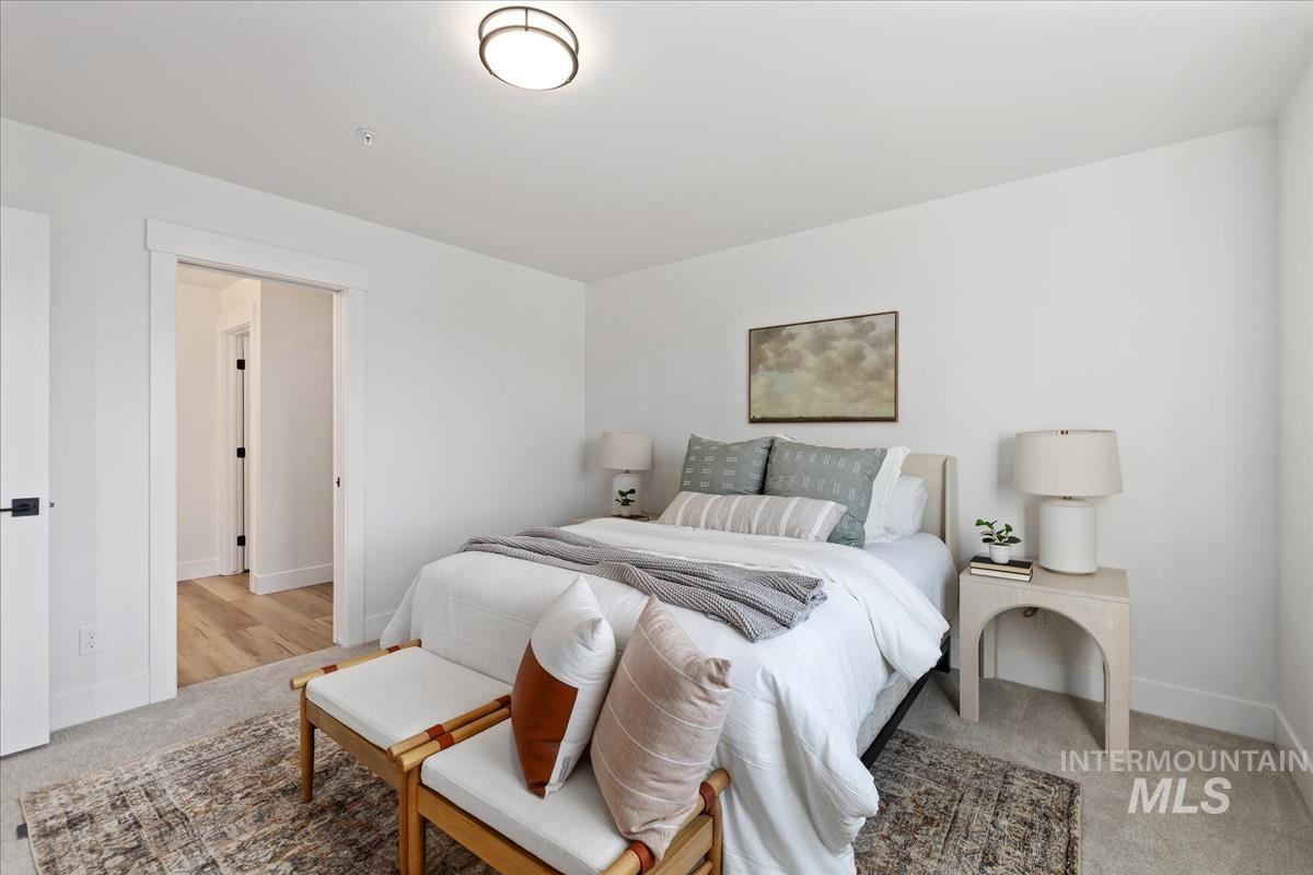 Bedroom with light carpet