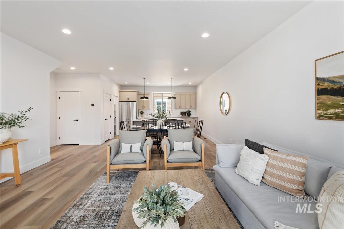 Living area featuring recessed lighting and light wood-style flooring