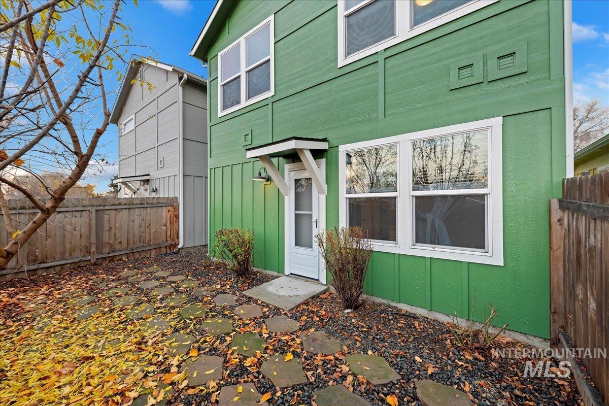 View of exterior entry featuring board and batten siding
