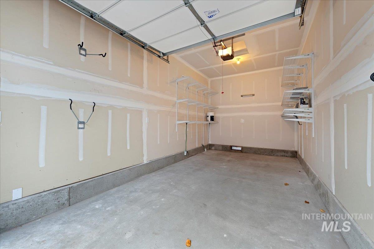 Garage featuring a garage door opener