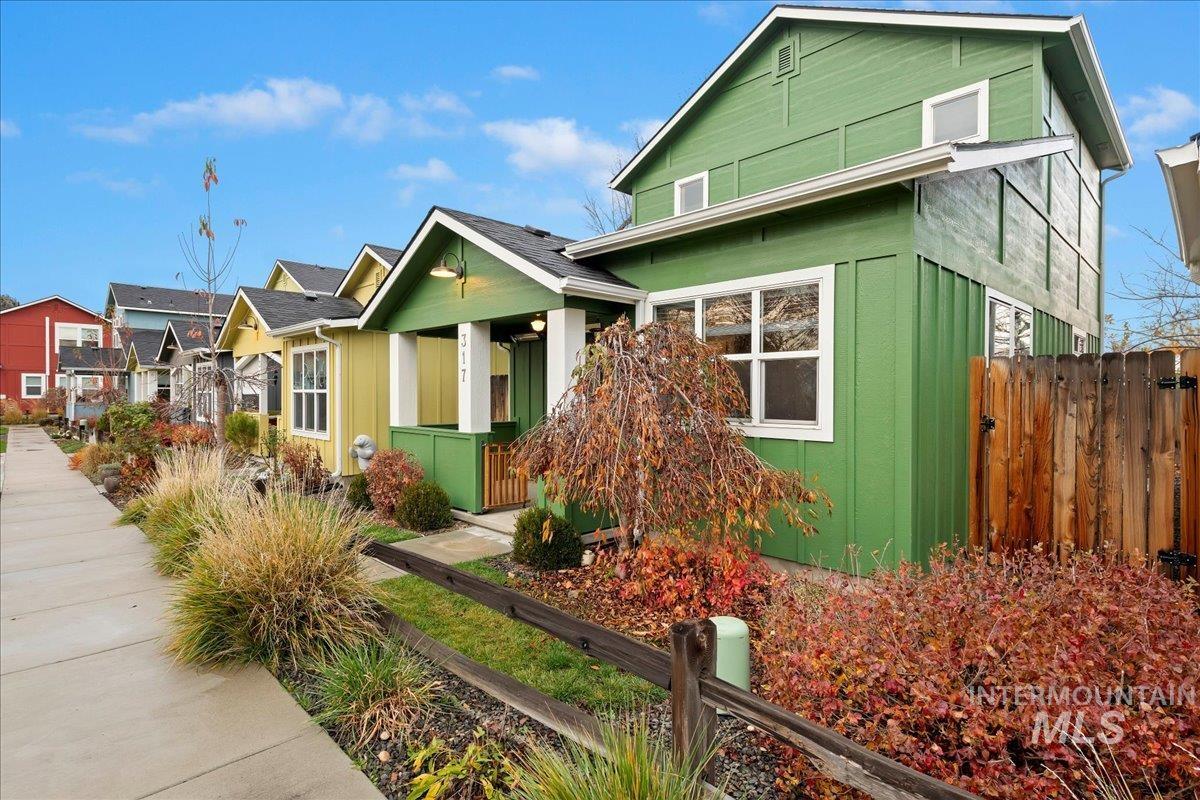 Craftsman-style home with a residential view and board and batten siding