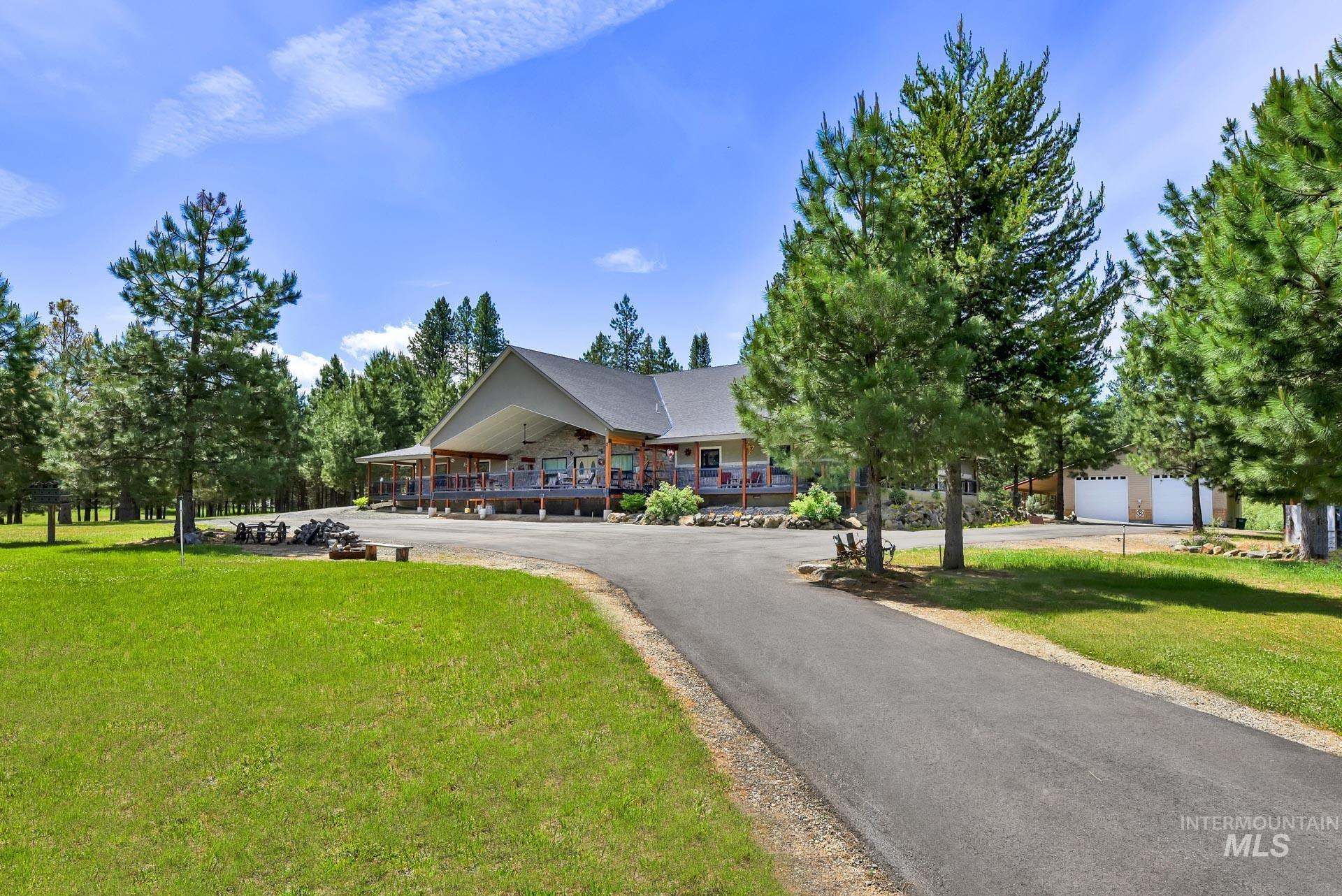View of front of home with a front yard and covered porch