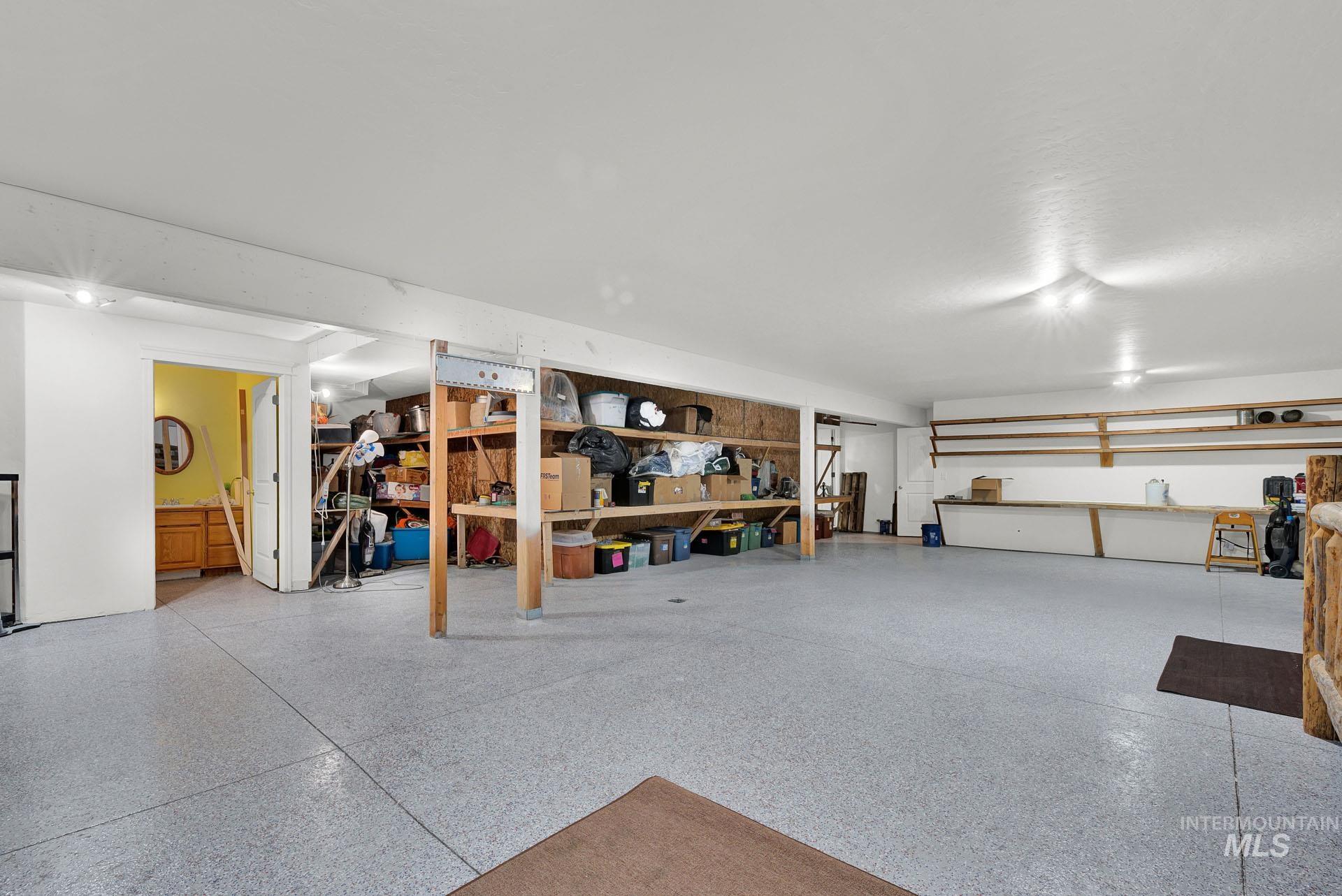 Recreation Room with built in storage and sealed concrete flooring