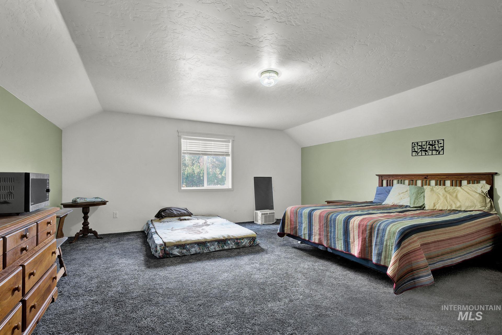 One of 2 upper bedrooms in the detached garage