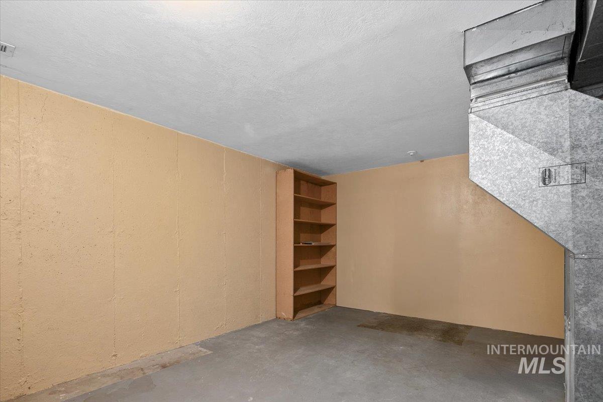 Below grade area featuring a textured ceiling