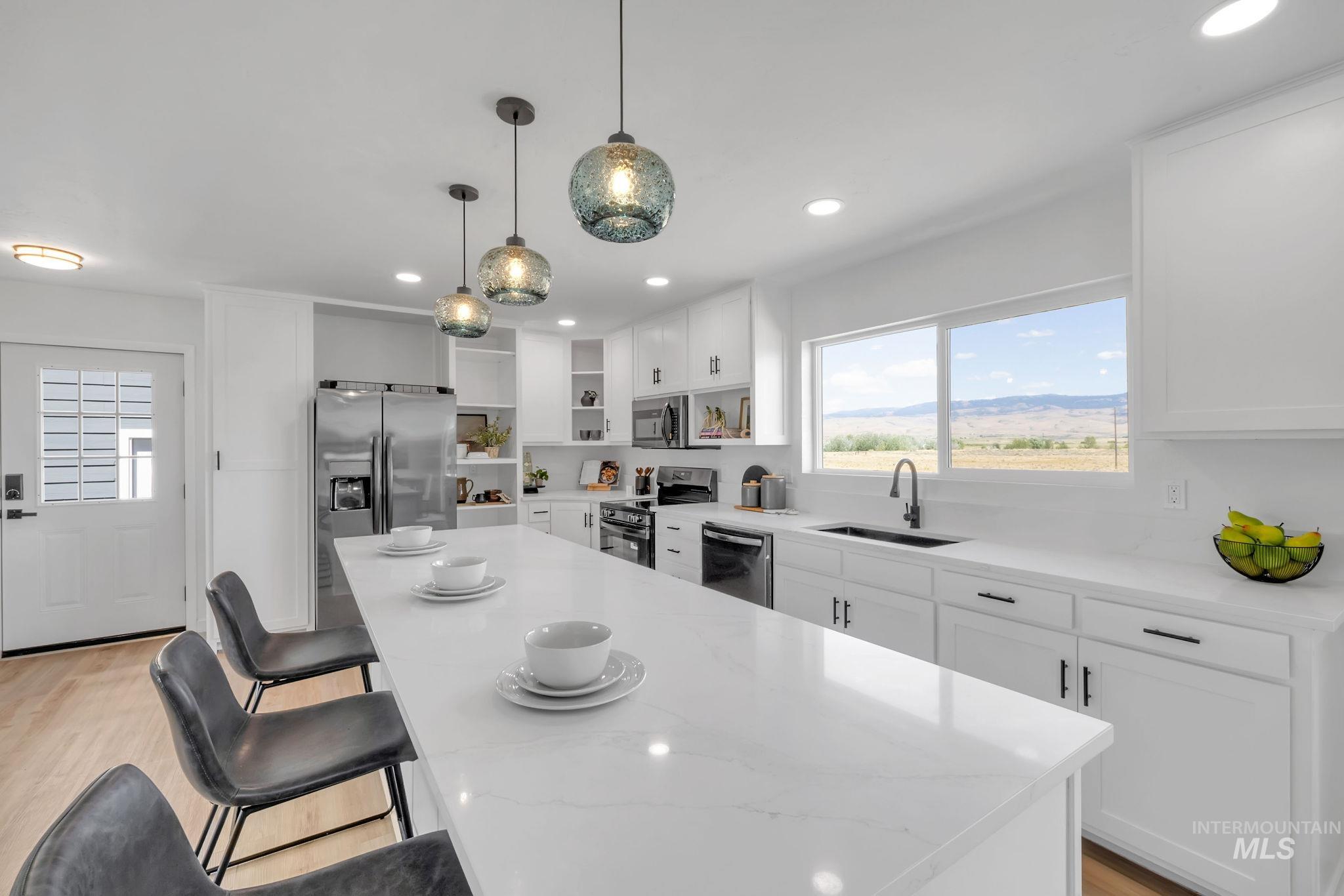 Kitchen featuring open shelves, stainless steel appliances, recessed lighting, light wood-style flooring, and white cabinetry