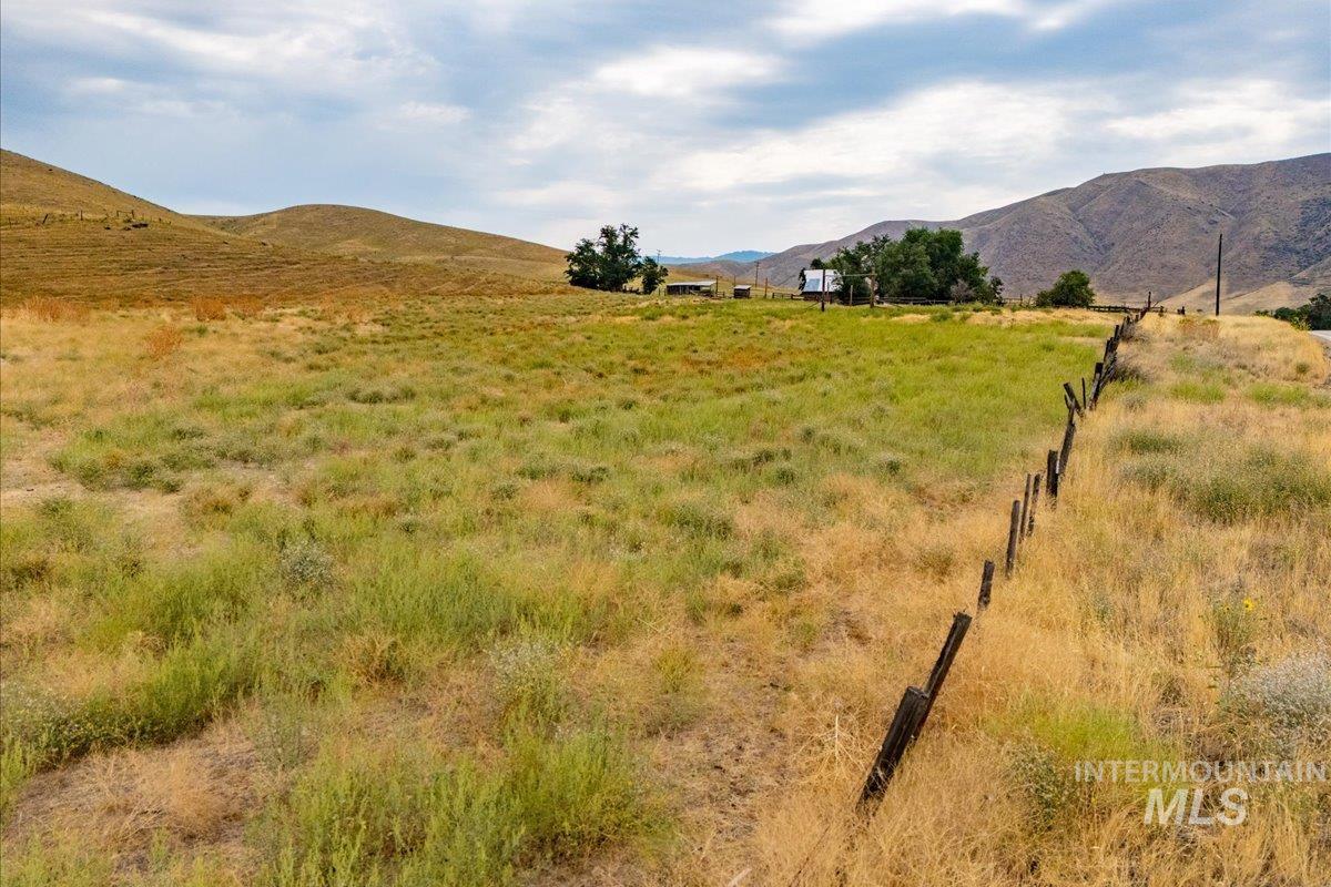 View of mountain background featuring rural landscape