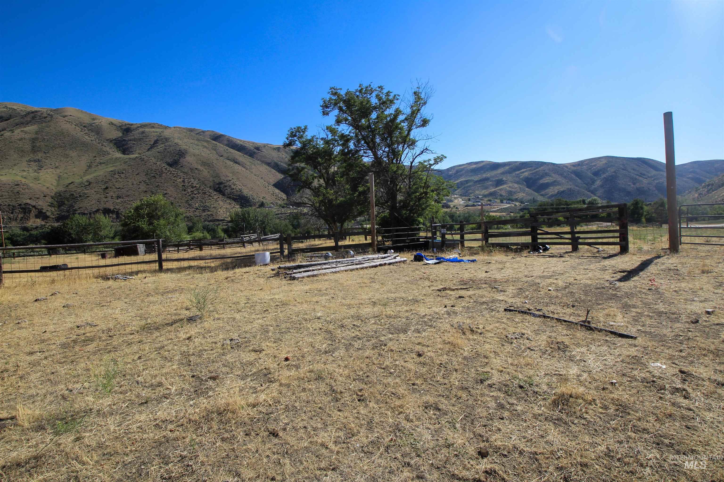 View of mountain background featuring rural landscape
