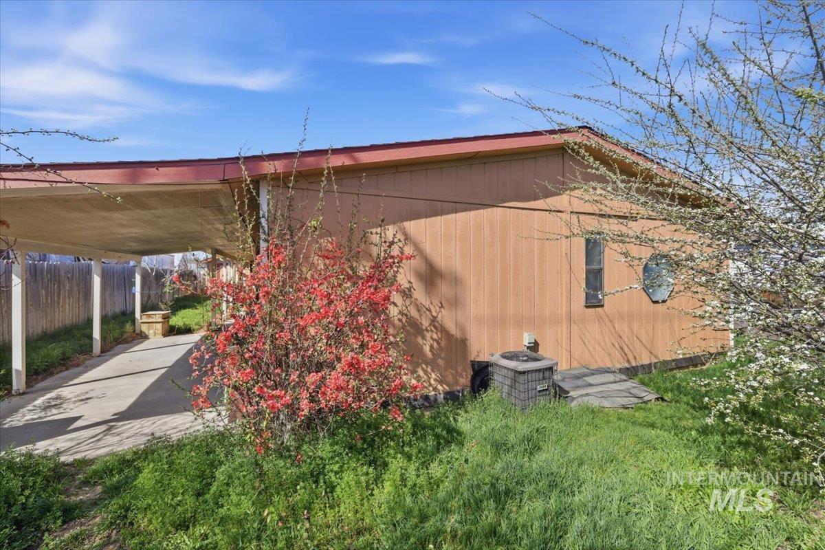 View of side of home featuring a central AC unit