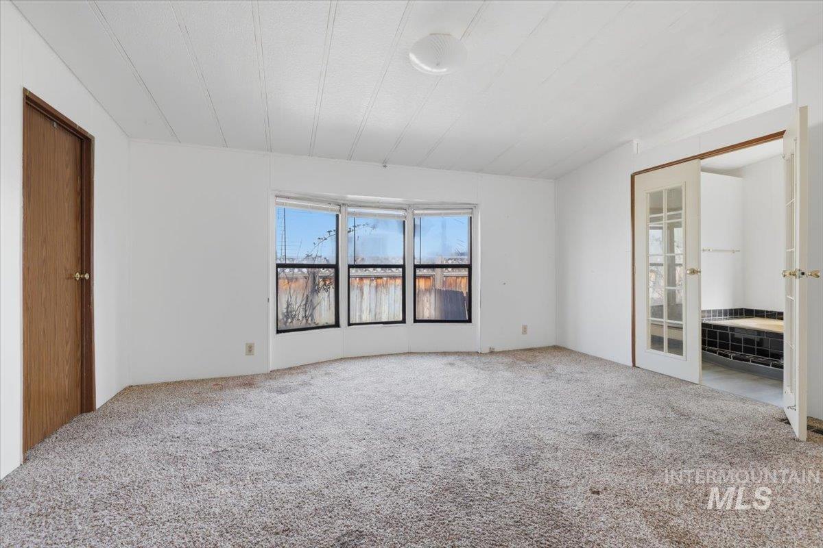 Unfurnished bedroom with carpet floors