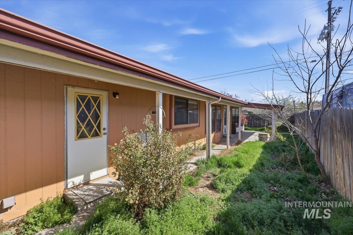 View of side of property with a fenced backyard