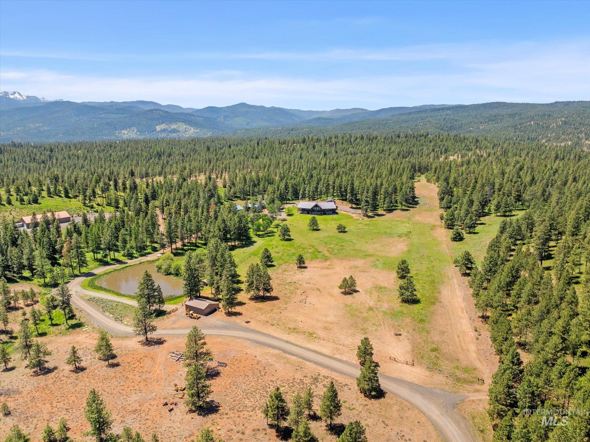 Bird's eye view of a heavily wooded area and mountains