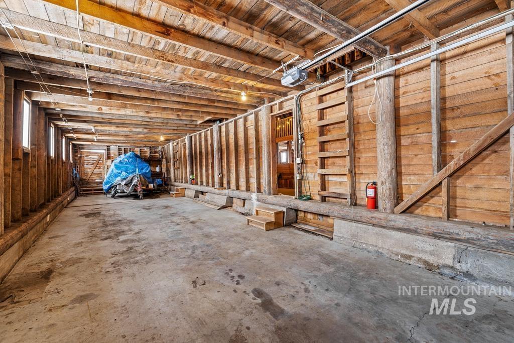 Miscellaneous room featuring concrete floors and a garage