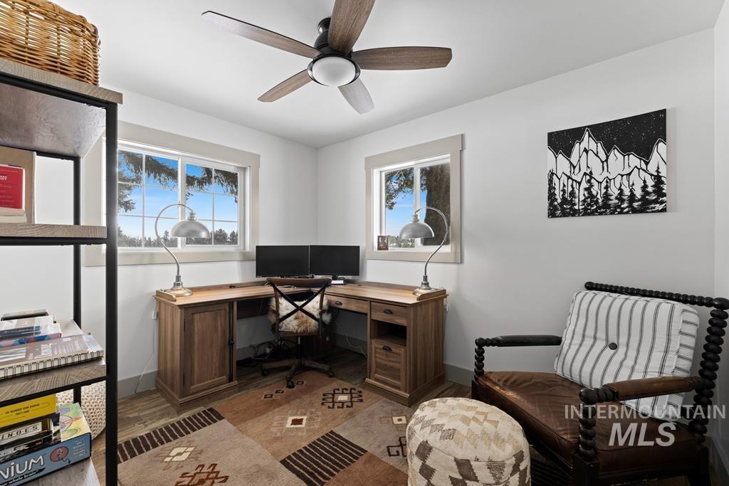Office featuring wood finished floors and a ceiling fan