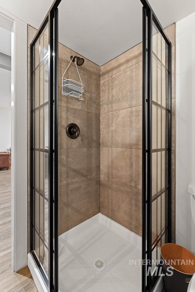 Full bathroom with a shower stall